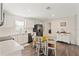 Bright kitchen features stainless steel appliances, white cabinets, and cozy breakfast nook at 3323 Parlow Ave, Spring Hill, FL 34606