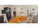 Kitchen with stainless steel appliances, wood-look flooring, and view to laundry and bedroom at 3323 Parlow Ave, Spring Hill, FL 34606