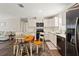 Modern kitchen features stainless steel appliances, quartz countertops, and seamless view into living area at 3323 Parlow Ave, Spring Hill, FL 34606