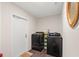 Laundry room with a washer, dryer, and shelving for storage at 3323 Parlow Ave, Spring Hill, FL 34606