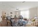 Bright living room features hardwood floors, a ceiling fan, and lots of natural light at 3323 Parlow Ave, Spring Hill, FL 34606
