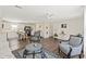 Open concept living room and kitchen with stainless steel appliances and hardwood floors at 3323 Parlow Ave, Spring Hill, FL 34606