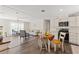 Open-concept living space featuring modern furnishings and natural light flowing from adjacent kitchen at 3323 Parlow Ave, Spring Hill, FL 34606