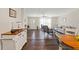 Spacious living area flowing into the kitchen, featuring modern furniture and a bright atmosphere at 3323 Parlow Ave, Spring Hill, FL 34606