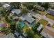 View of the home featuring a spacious backyard with an above ground pool and large storage shed at 3540 Linkwood St, New Port Richey, FL 34652