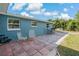 Relaxing back patio with mature landscaping is ideal for outdoor dining at 3540 Linkwood St, New Port Richey, FL 34652