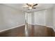 Comfortable bedroom features a large closet, hardwood floors, and a ceiling fan at 3540 Linkwood St, New Port Richey, FL 34652