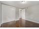 Cozy bedroom featuring a large closet, hardwood floors, and neutral wall paint at 3540 Linkwood St, New Port Richey, FL 34652