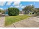 Beautiful home with front yard landscaping, brick walkway, and covered parking at 3540 Linkwood St, New Port Richey, FL 34652