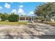 Charming single-story home with a well-maintained lawn, picket fence, and covered carport at 3540 Linkwood St, New Port Richey, FL 34652
