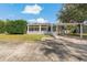 Charming home exterior with covered parking and well-maintained landscaping at 3540 Linkwood St, New Port Richey, FL 34652