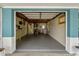 Spacious garage with blue trim, laundry area, and lots of storage space at 3540 Linkwood St, New Port Richey, FL 34652