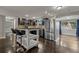 Modern kitchen with stainless steel appliances, island, and dark wood cabinets at 3540 Linkwood St, New Port Richey, FL 34652