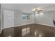 Inviting living room featuring hardwood floors and a bright front door at 3540 Linkwood St, New Port Richey, FL 34652