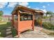 Inviting backyard tiki bar with seating provides the perfect spot for entertaining at 3540 Linkwood St, New Port Richey, FL 34652