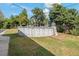 An above-ground pool is the focal point of this grassy backyard under a sunny sky at 3540 Linkwood St, New Port Richey, FL 34652