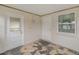 Enclosed porch features two doors, a window, and unique tile flooring at 3540 Linkwood St, New Port Richey, FL 34652