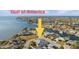 An aerial view of a waterfront community showcasing the beautiful canal and stunning homes at 3912 Rudder Way, New Port Richey, FL 34652