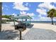 Scenic beach area with picnic pavilions and a grill, creating a perfect spot for outdoor dining and relaxation at 3912 Rudder Way, New Port Richey, FL 34652