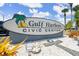 The Gulf Harbors Civic Center sign with landscaping and palm trees under a sunny sky at 3912 Rudder Way, New Port Richey, FL 34652