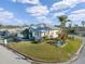Charming single-story home on a corner lot with lush landscaping and an attached two-car garage at 3912 Rudder Way, New Port Richey, FL 34652