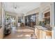 Inviting sunroom with tile floors, sliding glass doors, wet bar, and lots of natural light at 3912 Rudder Way, New Port Richey, FL 34652
