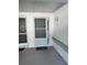 Inviting front door with screen and lock, with a decorative lamp at 4218 San Rafael Ave, New Port Richey, FL 34655