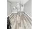 Spacious living room featuring modern gray wood-look flooring at 4218 San Rafael Ave, New Port Richey, FL 34655