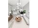 Bright living room features modern furnishings, neutral tones, and an open layout, perfect for entertaining and relaxing at 4218 San Rafael Ave, New Port Richey, FL 34655
