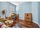 The room features hardwood floors, a window with shutters, and plenty of room for storage at 12824 Tikal Way, Trinity, FL 34655