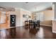 Inviting dining room with dark wood floors, elegant furnishings, and ample natural light at 12824 Tikal Way, Trinity, FL 34655