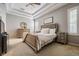 This main bedroom offers a calming atmosphere, neutral tones, and tray ceilings at 12824 Tikal Way, Trinity, FL 34655