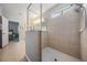 This shower features a glass surround, tiled walls, and a shower head at 12824 Tikal Way, Trinity, FL 34655