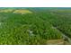 An aerial view showcases the home's location amidst lush forests and green spaces at 16325 Hibiscus Rd, Brooksville, FL 34601