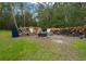 The backyard includes an outdoor sitting area with chairs and fire pit at 16325 Hibiscus Rd, Brooksville, FL 34601