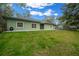 Front exterior of home with green lawn, complemented by verdant surroundings at 16325 Hibiscus Rd, Brooksville, FL 34601