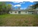 Charming home featuring a well-maintained front lawn and tidy landscaping at 16325 Hibiscus Rd, Brooksville, FL 34601