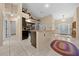 Contemporary kitchen with dark cabinetry, granite countertops, and an open design at 16325 Hibiscus Rd, Brooksville, FL 34601
