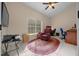 Living room featuring tile flooring, natural light, and a vaulted ceiling at 16325 Hibiscus Rd, Brooksville, FL 34601