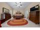 This spacious bedroom features a decorative ceiling fan and neutral paint at 16325 Hibiscus Rd, Brooksville, FL 34601