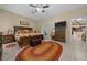 Spacious bedroom with a decorative ceiling fan and access to the patio at 16325 Hibiscus Rd, Brooksville, FL 34601