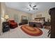 Spacious bedroom with a decorative ceiling fan and lots of natural light at 16325 Hibiscus Rd, Brooksville, FL 34601