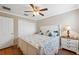 Bright bedroom features hardwood floors, neutral paint, and a large closet at 18819 Sunterra Dr, Land O Lakes, FL 34638