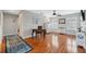 Bedroom featuring hardwood floors, shutters, fan, and ample natural light at 18819 Sunterra Dr, Land O Lakes, FL 34638