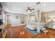 Spacious main bedroom features a canopy bed, hardwood floors, and ensuite bath at 18819 Sunterra Dr, Land O Lakes, FL 34638