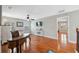 Home office featuring hardwood floors, natural light, and a ceiling fan at 18819 Sunterra Dr, Land O Lakes, FL 34638
