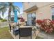 Outdoor patio with comfortable seating, bright plants and view of yard at 18819 Sunterra Dr, Land O Lakes, FL 34638