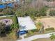 Aerial view showcasing a recreation area with beach volleyball court, playground, picnic table, and park benches at 18819 Sunterra Dr, Land O Lakes, FL 34638