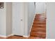 Interior view of hardwood stairway, base molding, and fresh paint at 18819 Sunterra Dr, Land O Lakes, FL 34638
