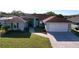 Charming single-story home with a well-manicured lawn and a two-car garage at 5647 Dalton Ct, New Port Richey, FL 34655